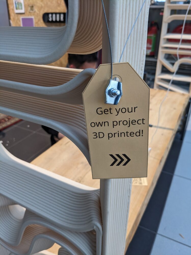 Detail of a tag on a large scale 3d-printed structure made with recycled materials at the Bespoked Fair 2023